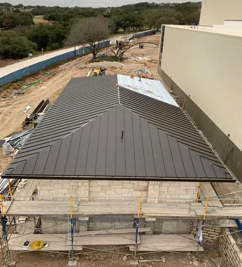 Metal roof new construction with scaffolding in Parker